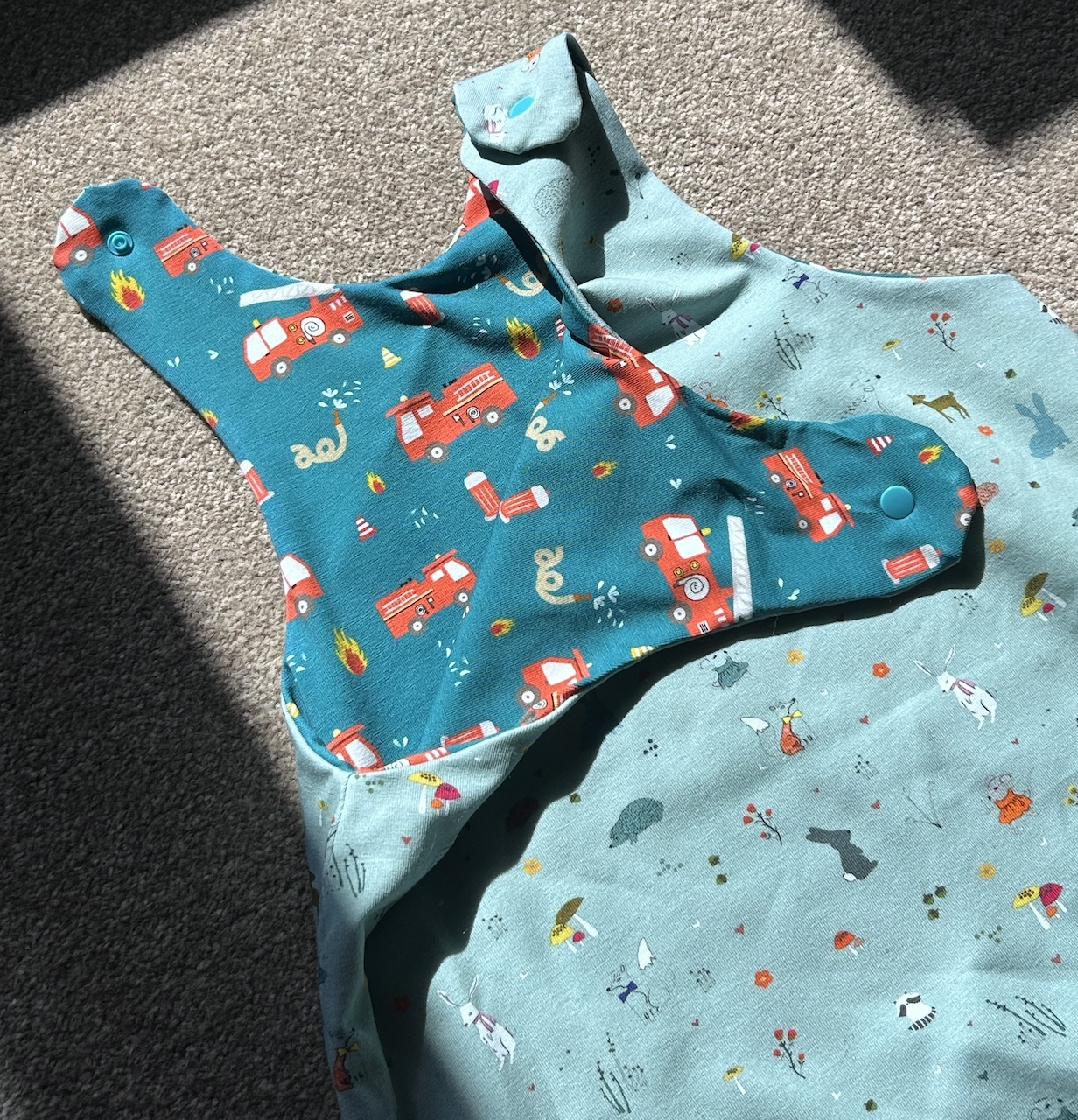 Home made Reversible romper suit with fire engines on one side and country scene with animals on the other