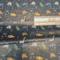 ECO-LAMINATED | MARCHING DINO (Mustard)