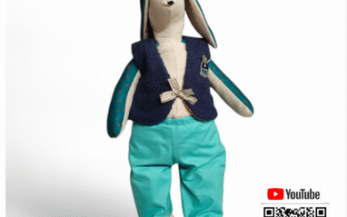 Lock Rabbit waistcoat & trousers pattern front cover. Shows toy rabbit with the clothes on. Level, beginner