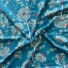 Viscose fly away dark blue. Dark blue fabric with mainly white flowers with bits of pink, red, yellow and orange
