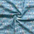 Corduroy Duck's Picnic Day Light Blue. Light Blue background. Ducks with ducklings, cats and flowers in bright colours.