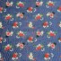 Garden Rose cotton fabric in medium sapphire, featuring a pattern of red, pink, and cream roses with white and navy florals, green foliage, and coral berry sprigs on a deep blue background