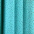 Little Rose cotton fabric in Morning Green, featuring small clustered sprigs of red and cream rosebuds with green leaves scattered on a teal background, with a fine dotted pattern.