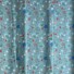 My Little Garden cotton fabric in pistachio, featuring a scattered floral pattern with white, coral, red, and blue blooms, taupe flowers, and green foliage on a sage green background