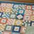 Finished patchwork quilt created using fabric squares cut with the PNQ Square Stamp Set